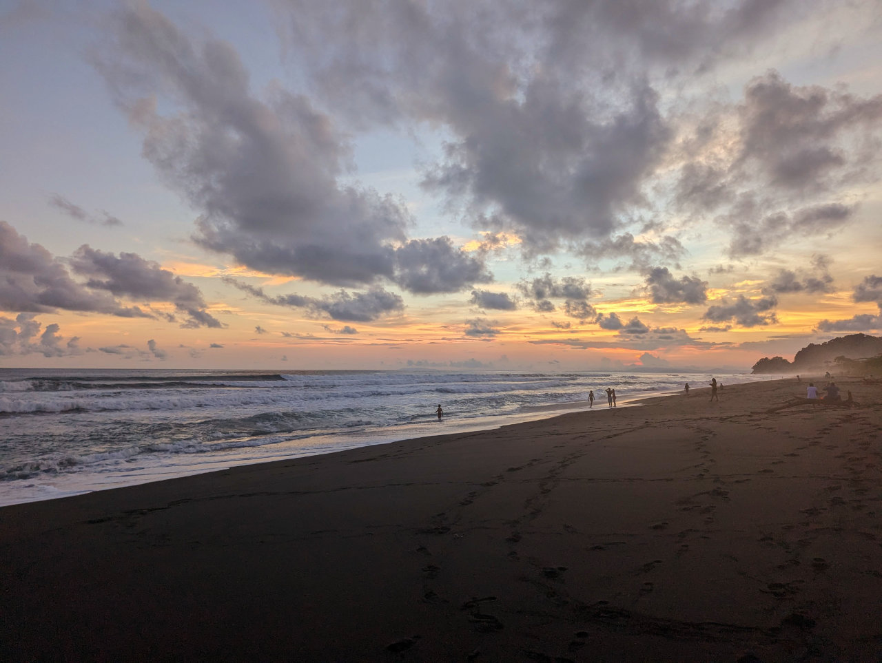 Costa Rican black sand beach at sunset